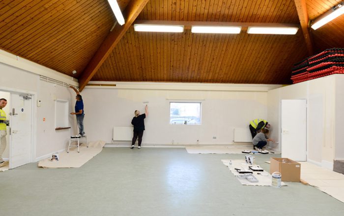 Appre tices paint a large communal space as part of the dulux painting masterclass