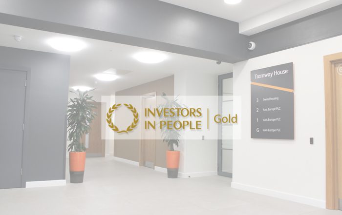 Aixs office with the investors in people gold award logo