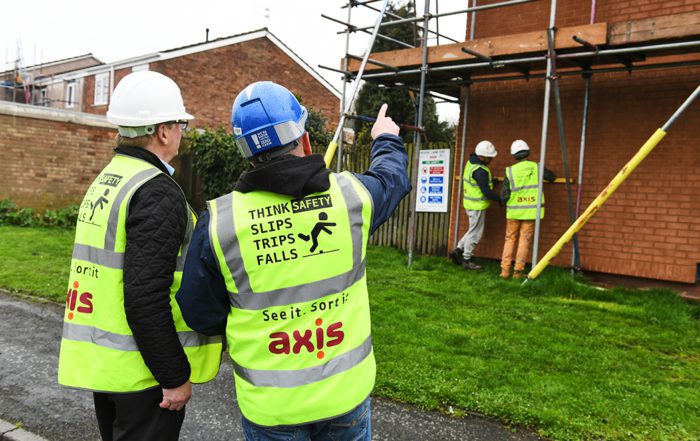 Axis site operative discusses works with manager