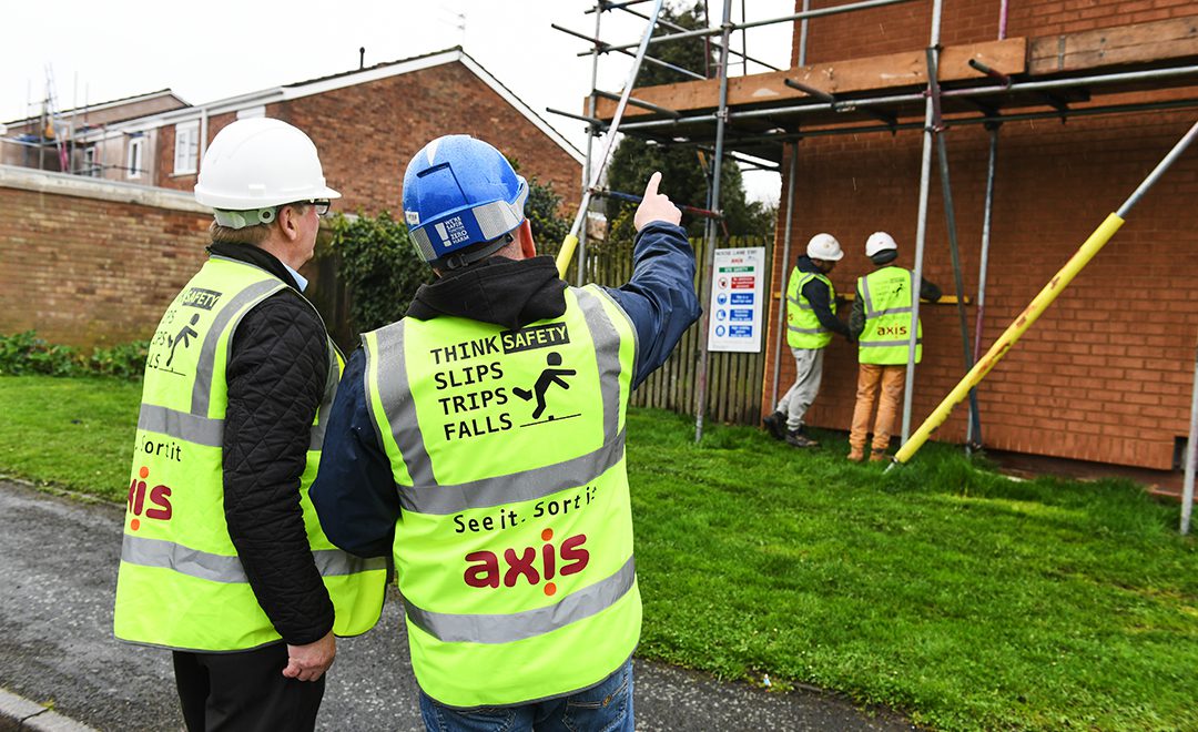 Axis site operative discusses works with manager