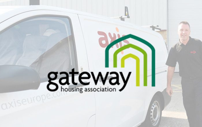 Axis person stands beside a van to announce new contract win with Gateway housing