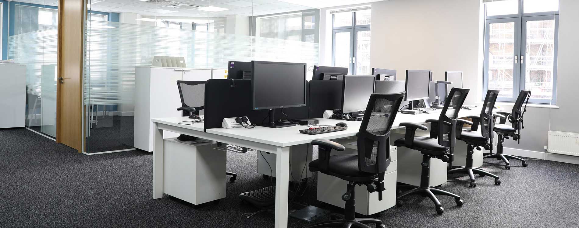 bank of desks in a bright and spacious office