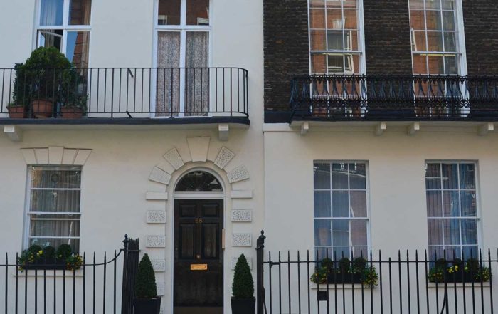 Balcony's and doors at the front of a London home restored by axis