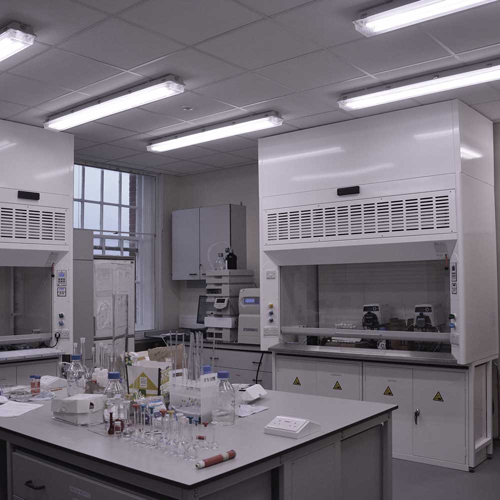 Science Lab workspace with test tubes, chemicals and other equipment