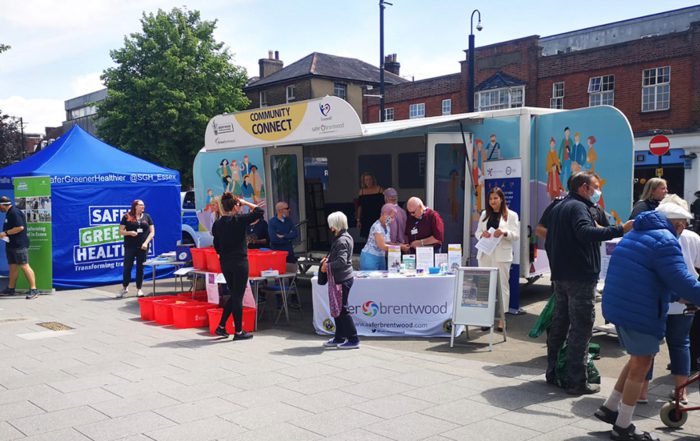 Axis team talking to residents at the Community Connect trailer event