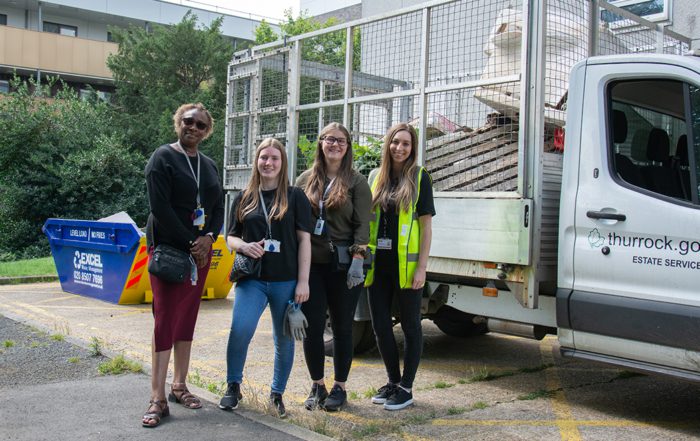 Volunteers with the skip and the caged van were residents disposed of waste sustainably