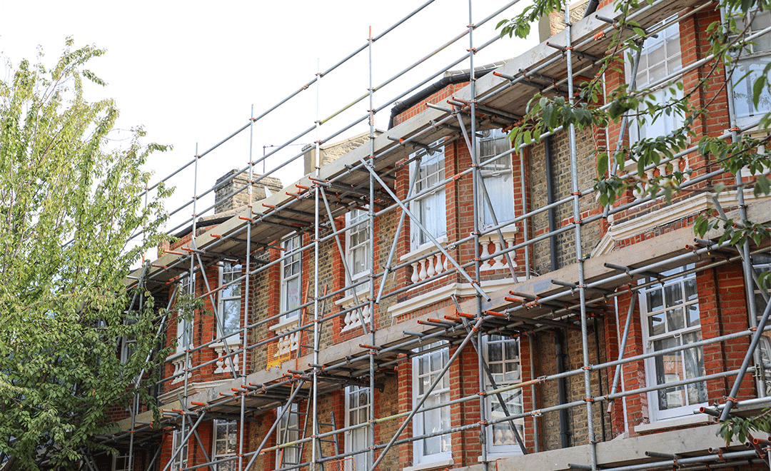 External facade with scaffold Victorian terraced houses Morat Street