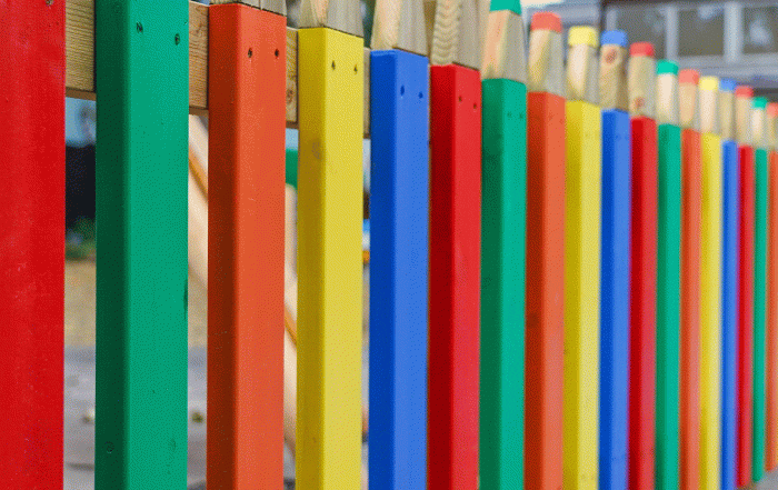 School Playground fencing in form of brightly coloured pencils