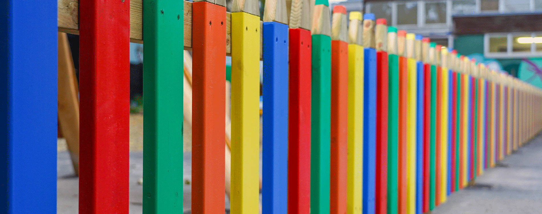 School Playground fencing in form of brightly coloured pencils