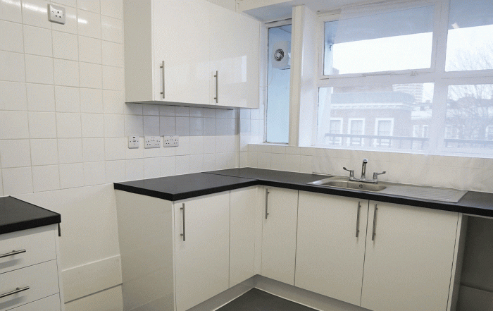 kitchen with white fitted goods and tiles