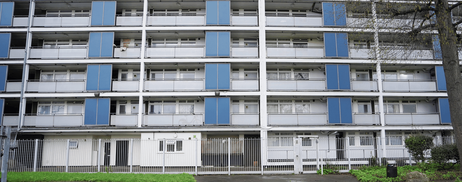 Block of white and blue flats.
