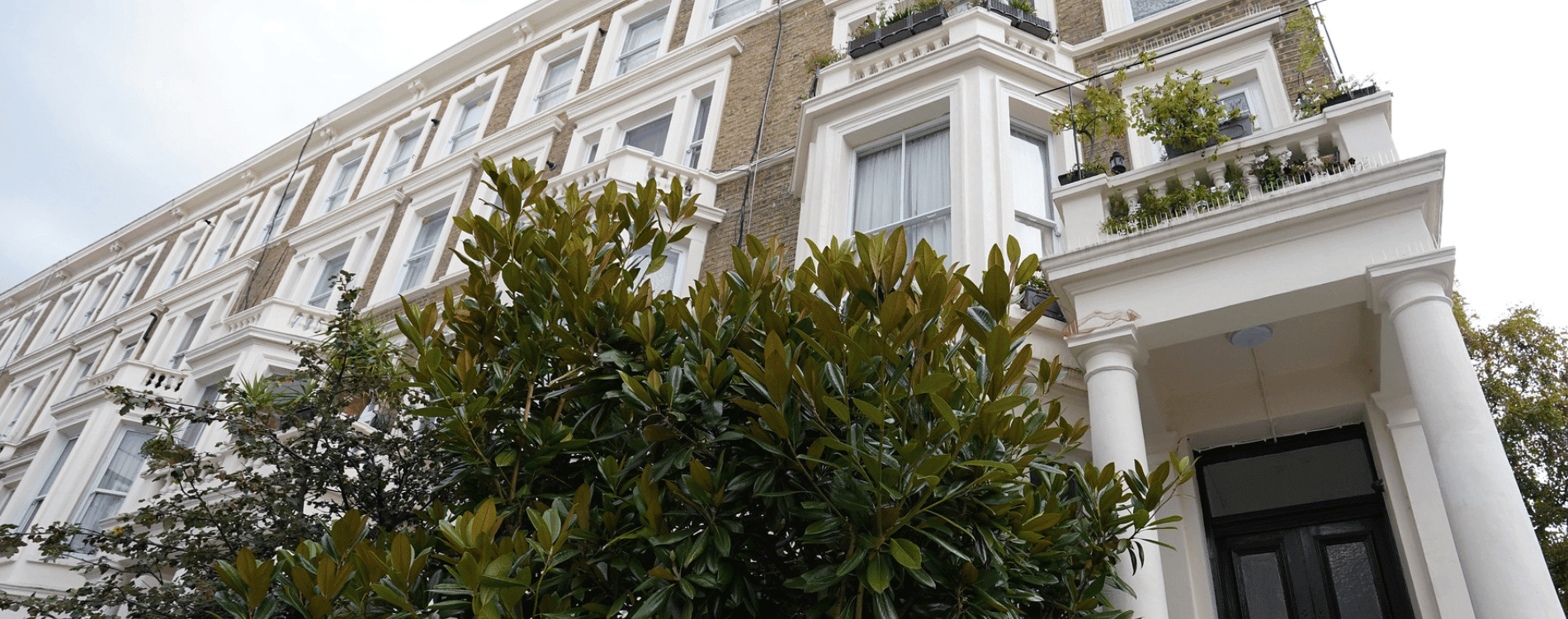 Victorian Property with white framing of windows and doors.