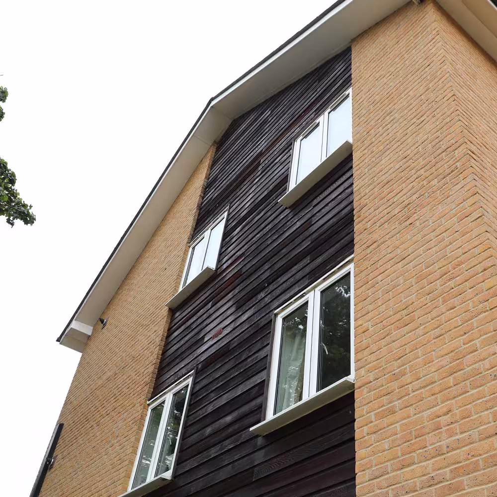 Street-level view of residential properties with contemporary design and community layout.