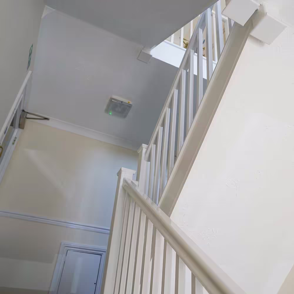 Crane and construction equipment working on a large-scale residential development site.