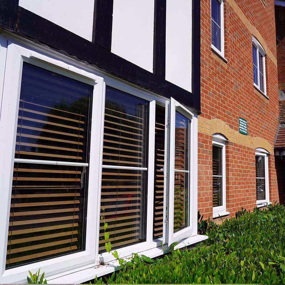 Architectural close-up showing façade details and window alignment on new housing units.