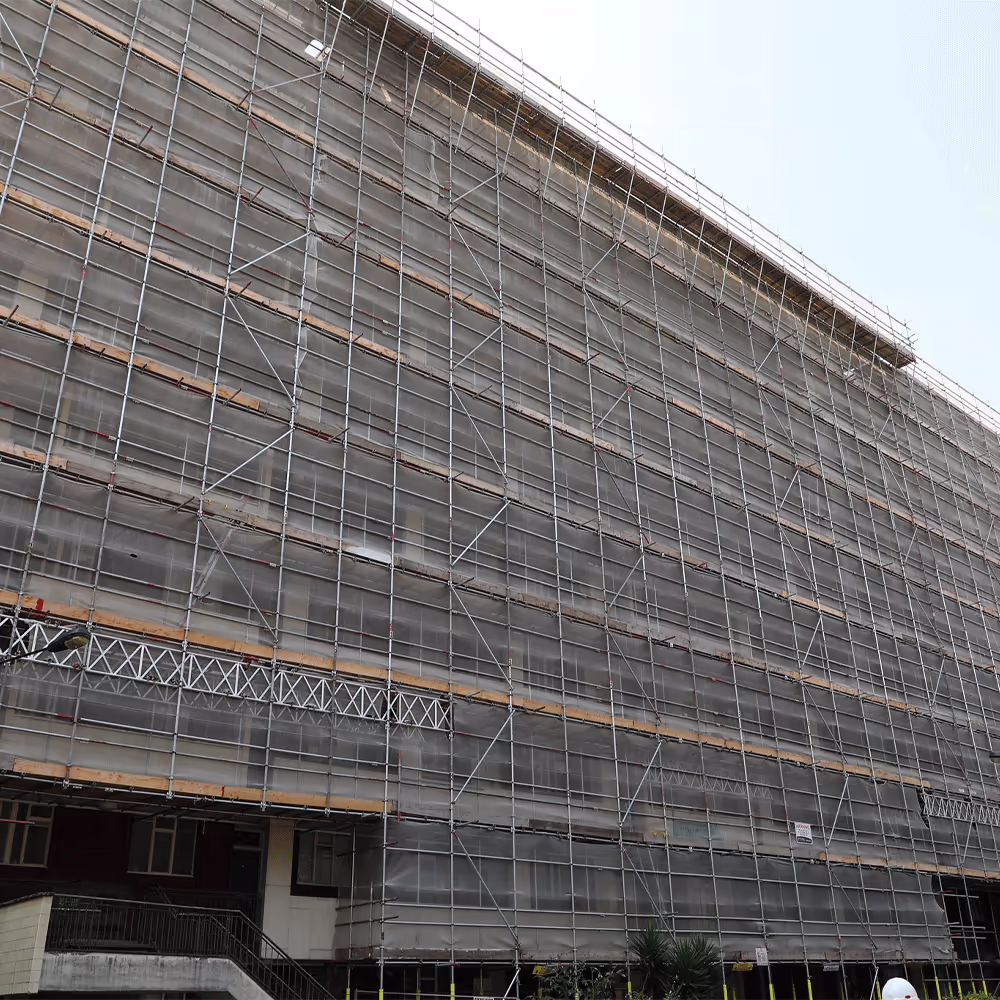 Aerial shot showing multiple construction sites operating concurrently under coordinated project management.