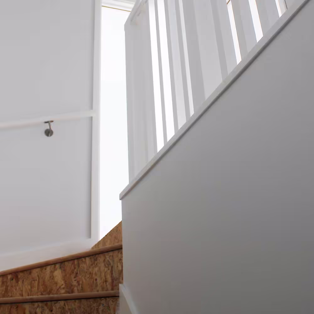 Interior view of a new-build home featuring energy-efficient windows and open-plan design.