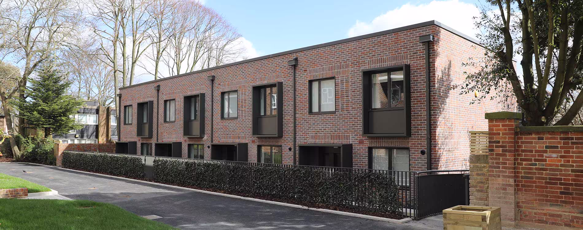 Panoramic view of a new housing development showcasing modern architecture and sustainable construction practices.