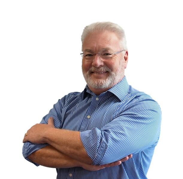 Old man with glasses smiling, with blue shirt