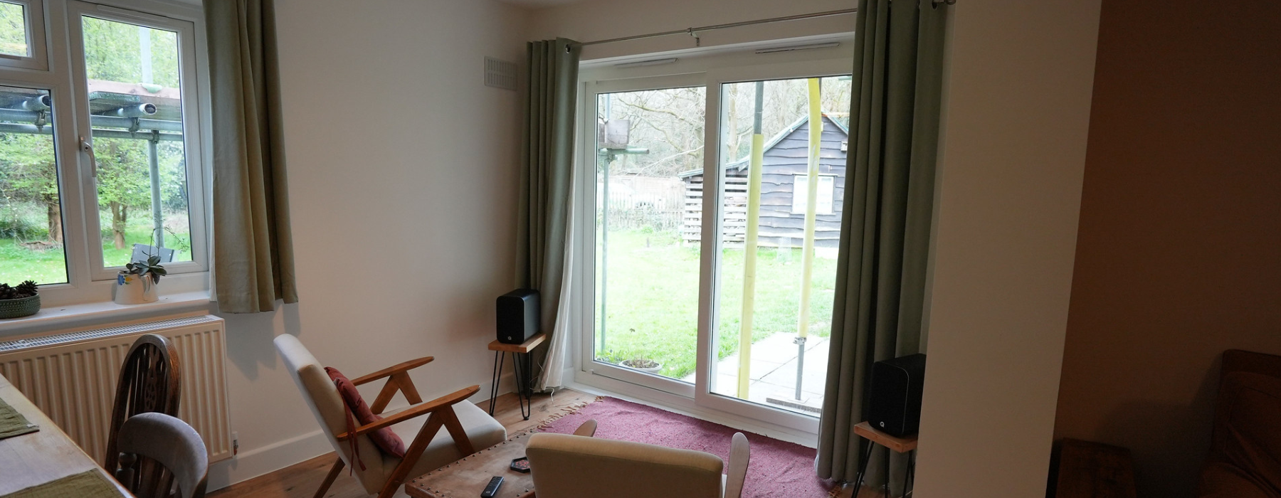 Inside lodge refurbishment with table and chairs. Two large windows